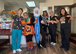 The Serene Dental team in Halloween costumes celebrating with patients